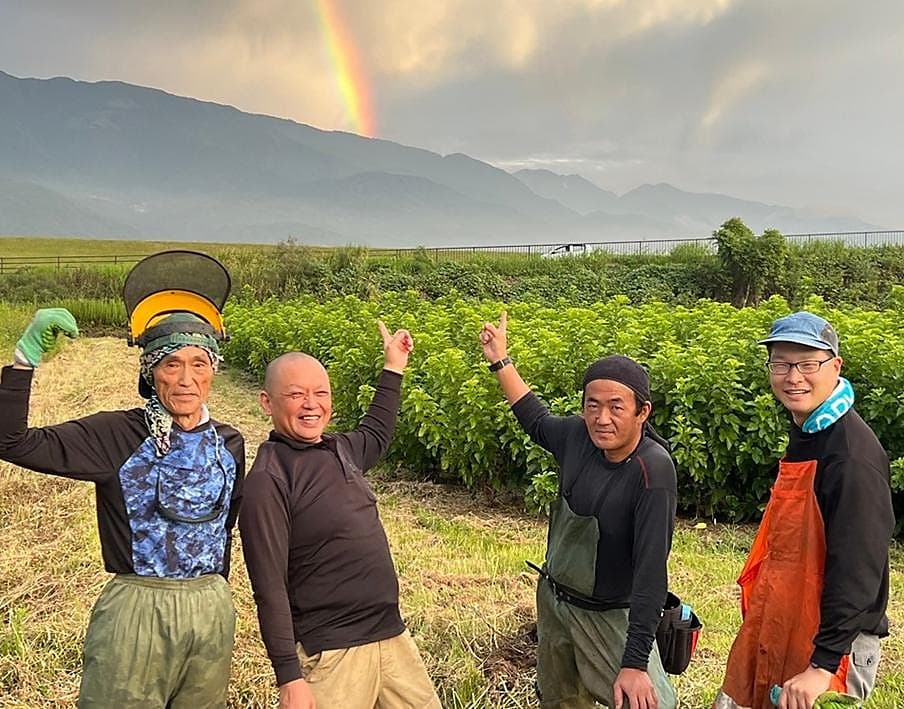 The farm team celebrating after a harvest